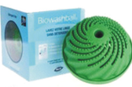 A green Biowash Ball next to its packaging, designed for laundry use. - International Hotel School