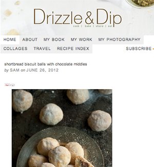 Shortbread biscuit balls dusted with powdered sugar, revealing chocolate middles. - International Hotel School