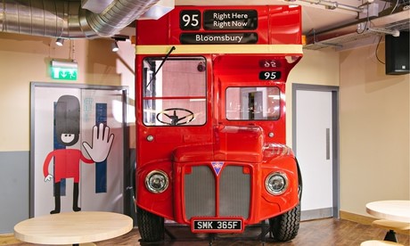 A red double-decker bus with route number 95 displayed prominently on the front. - International Hotel School