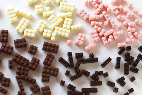 Collection of chocolate building blocks in various colors including pink, white, and brown. - International Hotel School