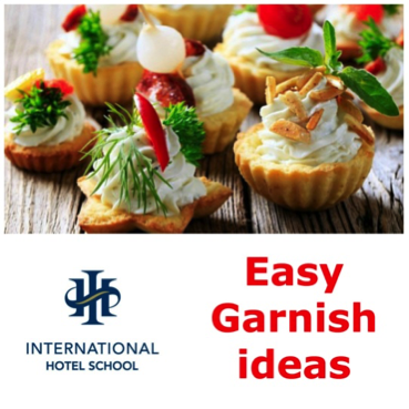 Mini tarts filled with cream and garnished with vegetables and herbs, presented on a wooden surface. - International Hotel School