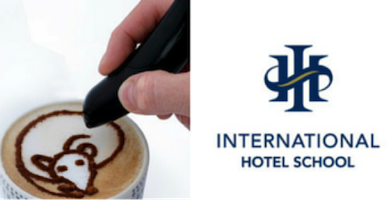A hand using a tool to create bear-shaped latte art on a coffee surface. - International Hotel School