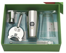 Alessi bartending tool set including shaker, jigger, strainer, and stirring stick in a green box. - International Hotel School