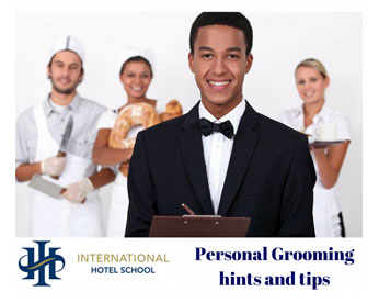 A group of hospitality students at International Hotel School discussing personal grooming tips. - International Hotel School