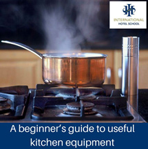 A stainless steel pot with steam rising on a gas stove in a kitchen setting. - International Hotel School