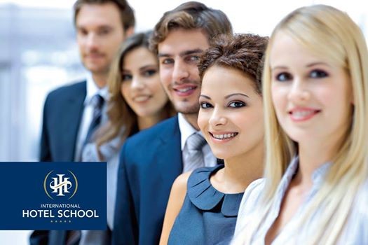 A group of five students from International Hotel School posing for a photo, wearing formal attire. - International Hotel School