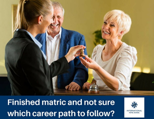 A woman handing a key to a smiling woman while a man looks on, discussing career options. - International Hotel School