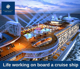 Cruise ship deck featuring a pool area and lounge chairs under bright lights at night. - International Hotel School