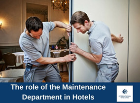 Two hotel maintenance staff members repairing a sliding door in a hotel setting. - International Hotel School
