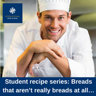 Smiling culinary student in a chef's uniform presenting a recipe for breads at International Hotel School. - International Hotel School
