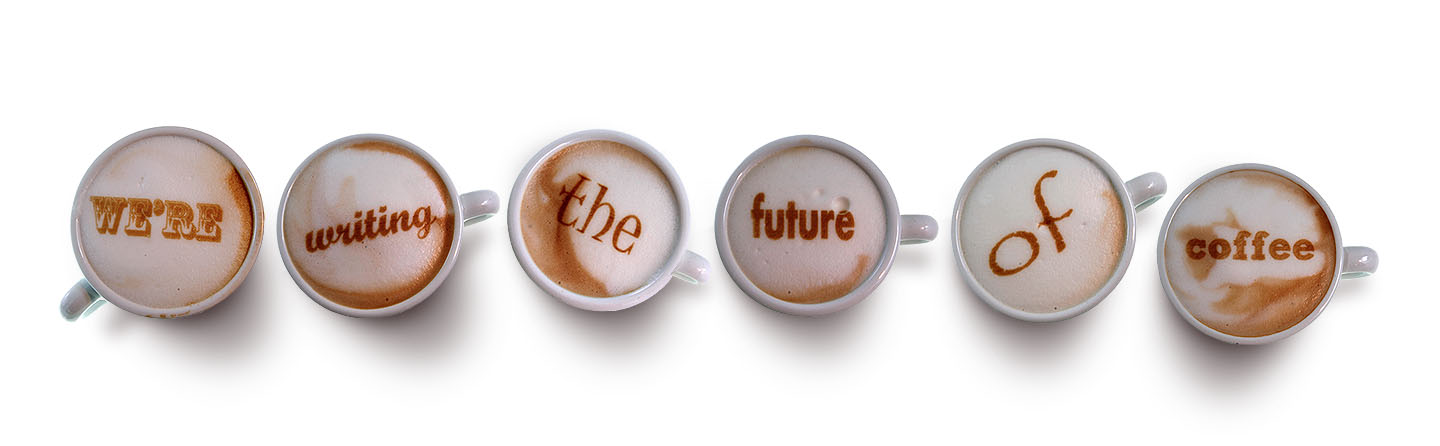 Six coffee cups arranged in a row with latte art displaying the text 'WE'RE writing the future of coffee'. - International Hotel School