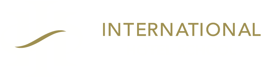 Logo of the International Hotel School featuring a stylized design in gold and white. - International Hotel School