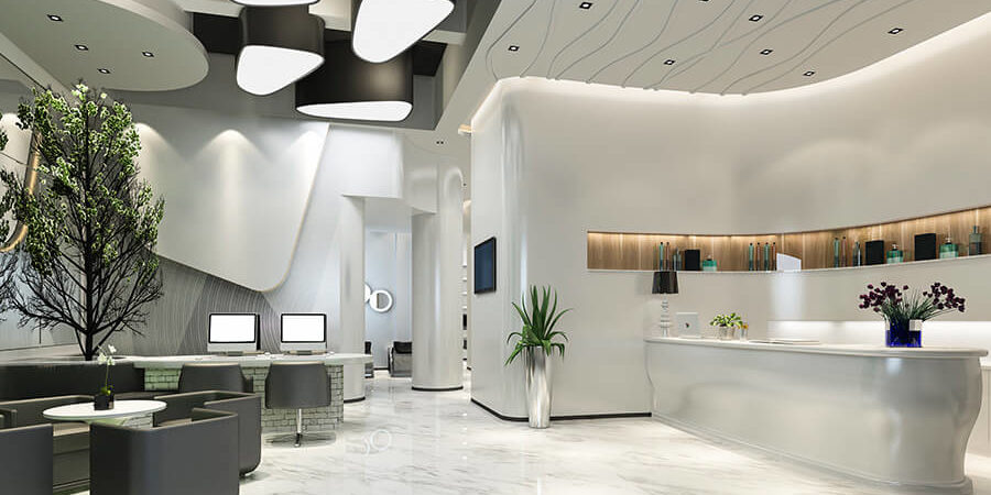 A modern reception area featuring sleek furniture, a marble floor, and contemporary design elements. - International Hotel School