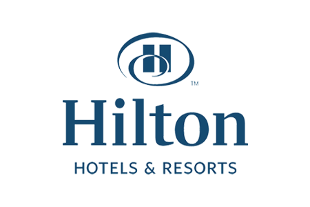 Logo of Hilton Hotels & Resorts featuring the name in blue with a stylized emblem. - International Hotel School